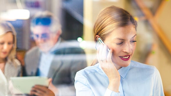 Female professional negotiating latest opportunity on mobile Female professional negotiating latest opportunity