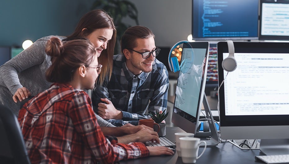 Team of programmers working in office